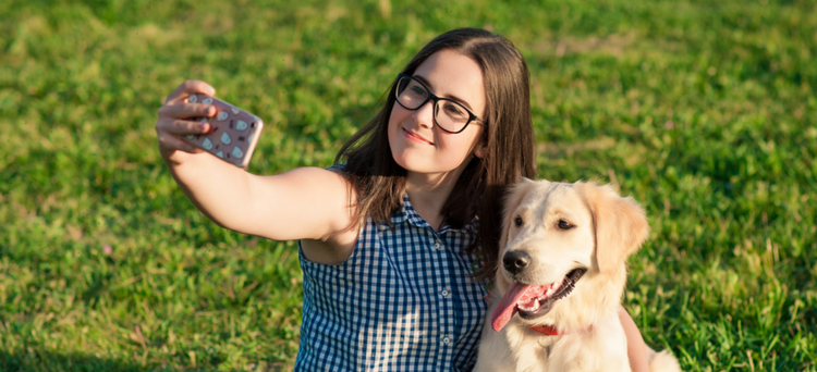 A girl takes a selfie with her soon to be Instagram-famous dog.